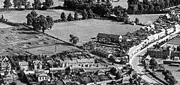 Aerial view showing fields and houses