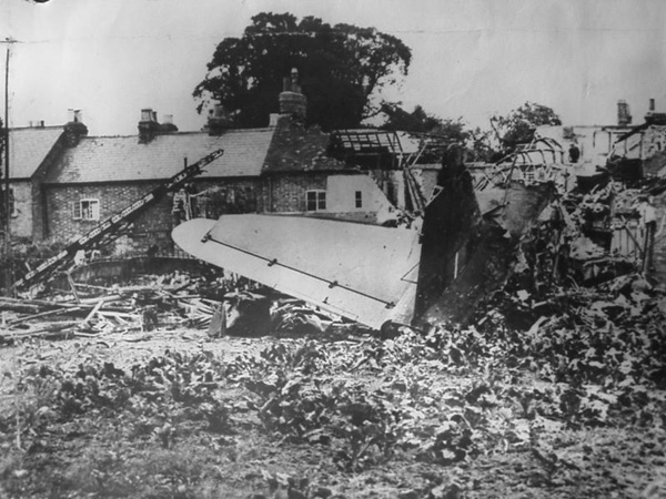 The wrecked plane and remains of the houses