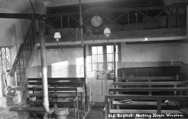 Interior of meeting house with gallery and east door